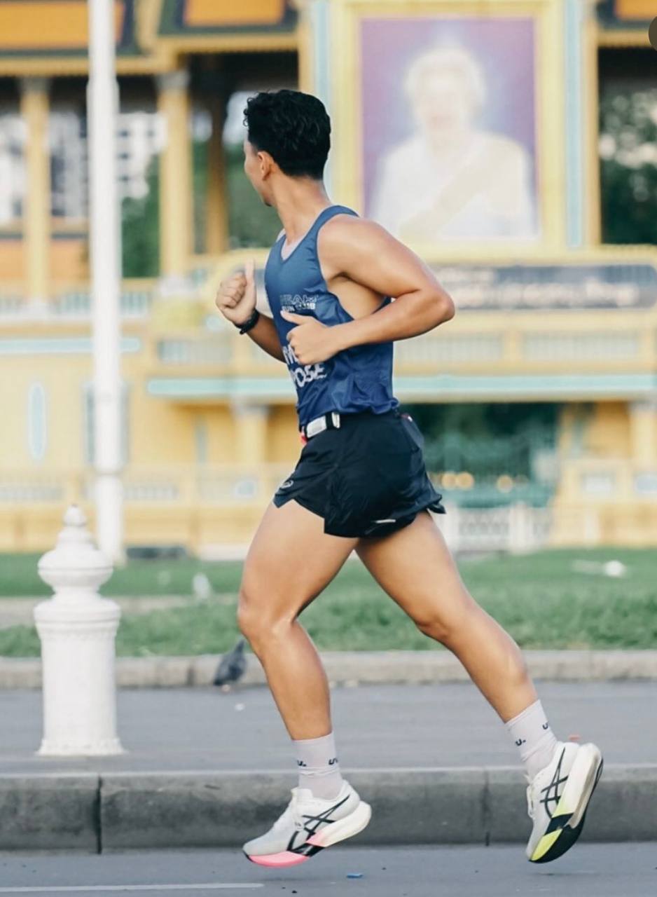 Christopher Chea running past Phnom Penh landmarks