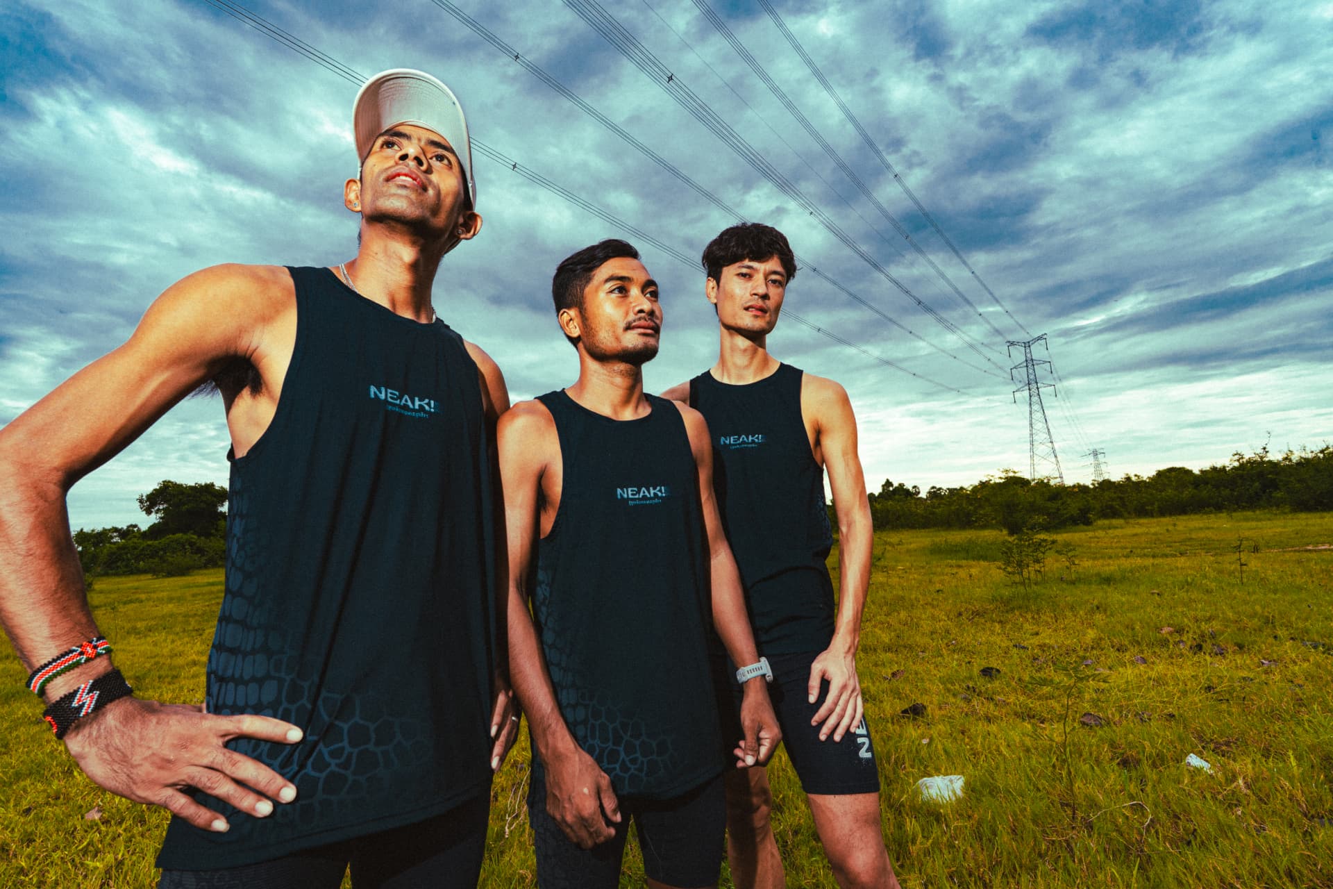 Three runners in Black Dragon kit outdoors
