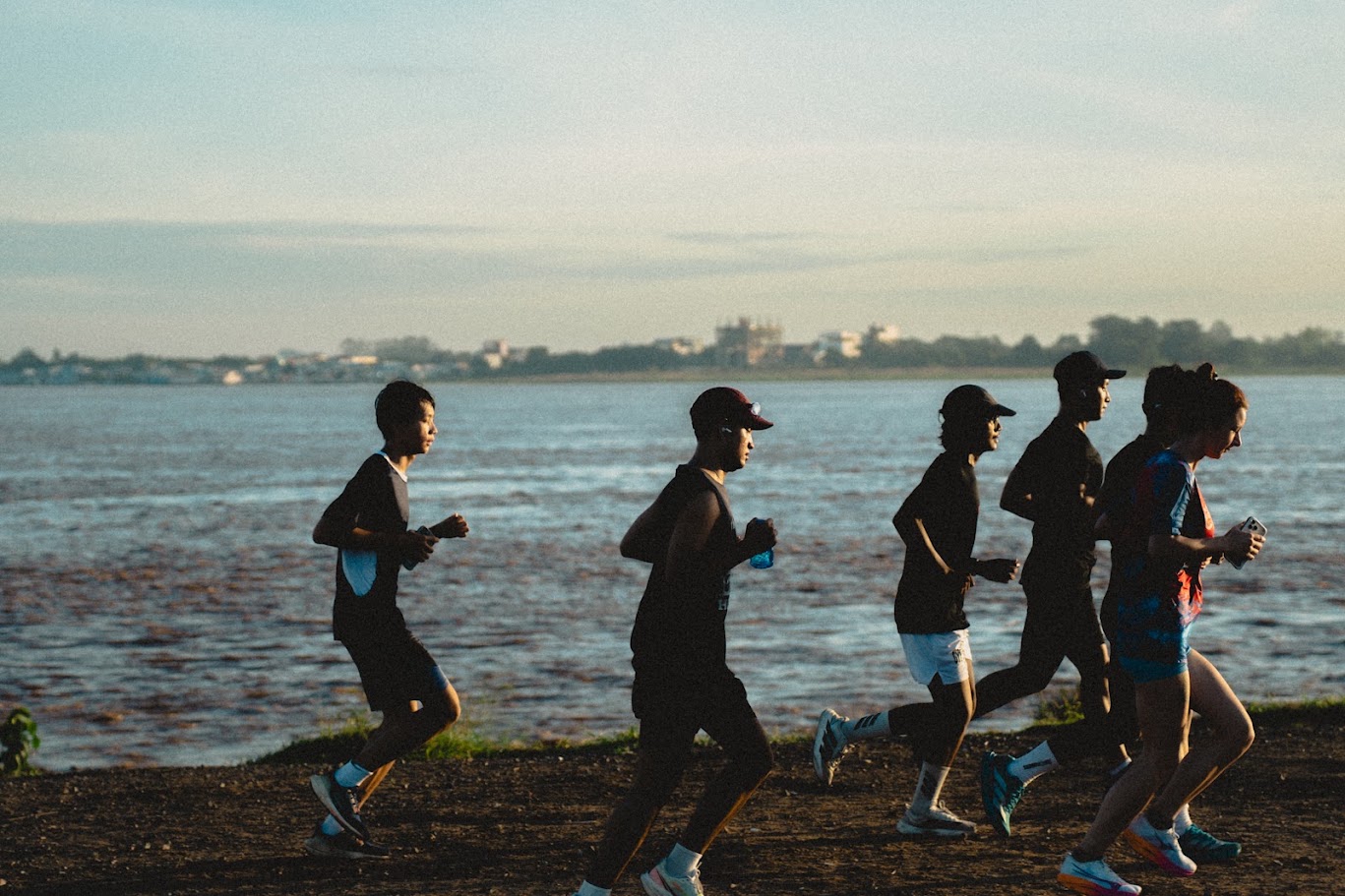 The NEAK pack running across a bridge